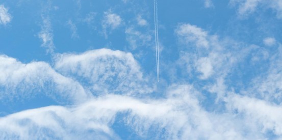 sky ceiling with plane trail fluorescent light covers